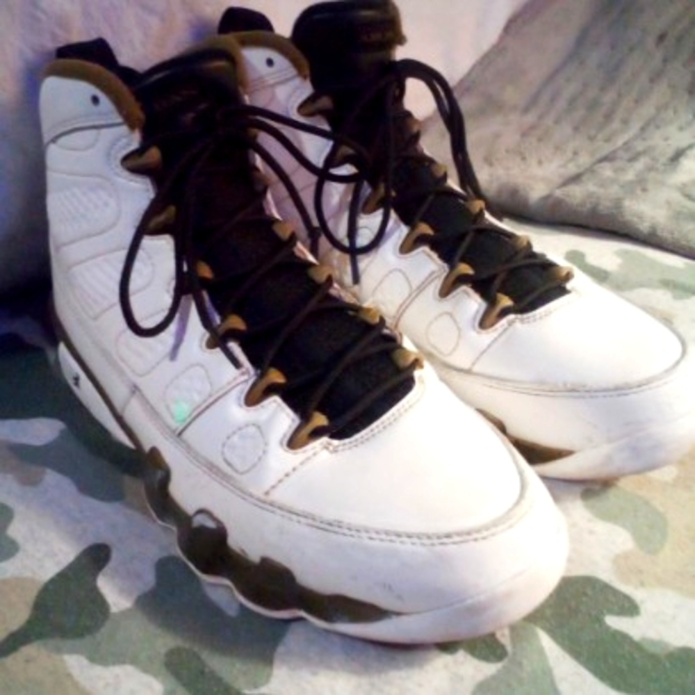 Iconic Nike Air Jordan 9. White leather with gold accent.